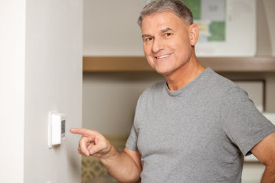 Pete from PowerHouse using a smart thermostat