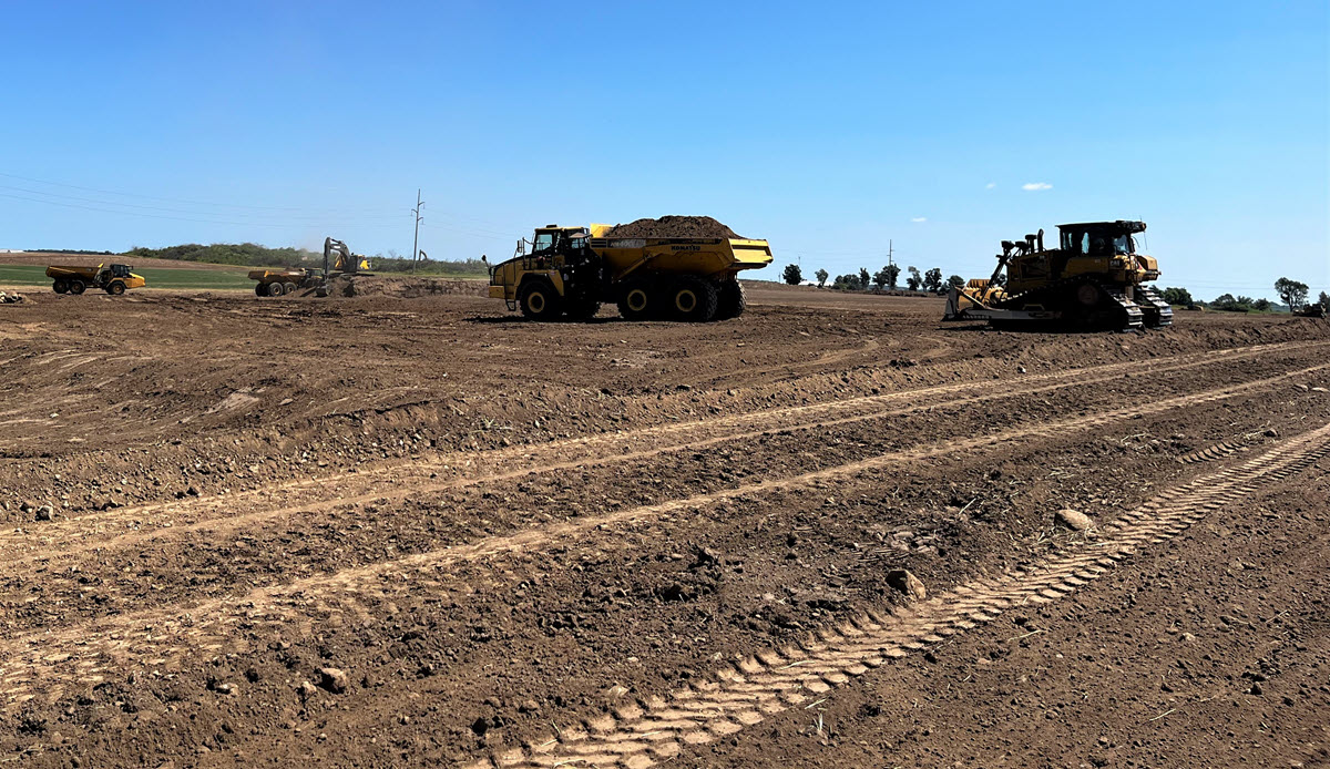 Crews move dirt to ensure the future solar panels can be installed in even rows and track with the sun at the proper angle.