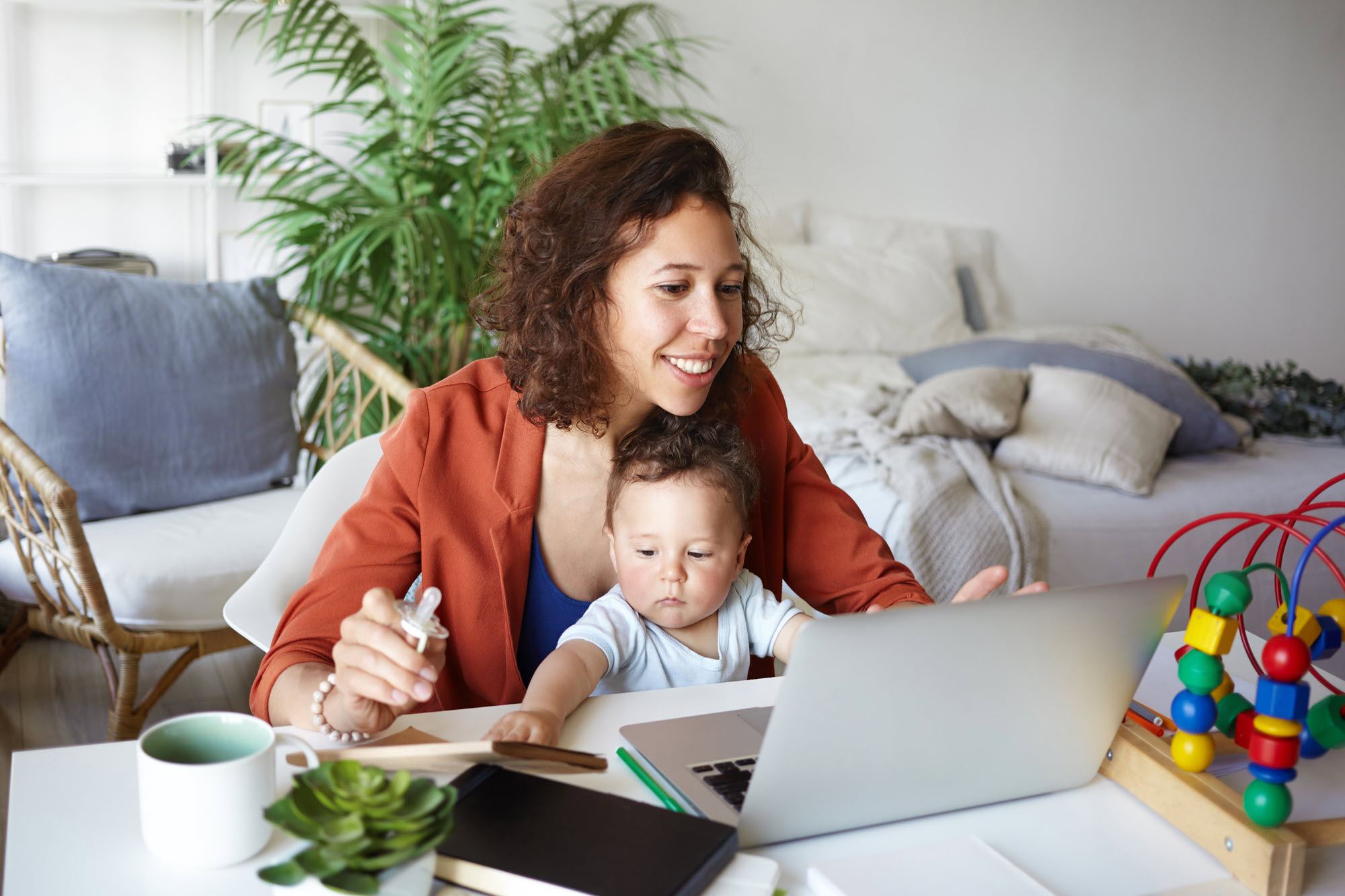 mom and baby with a laptop