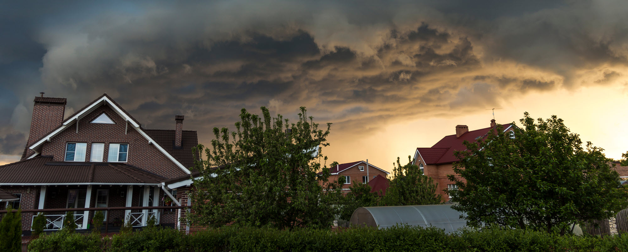 ominous storm clouds over a house