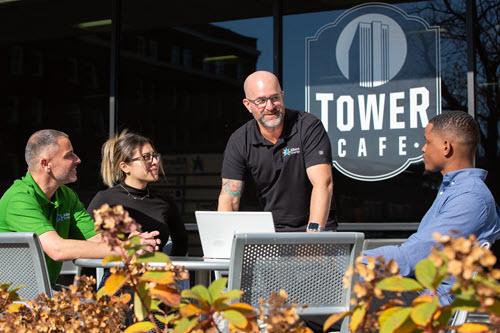 Employees at a table outdoors