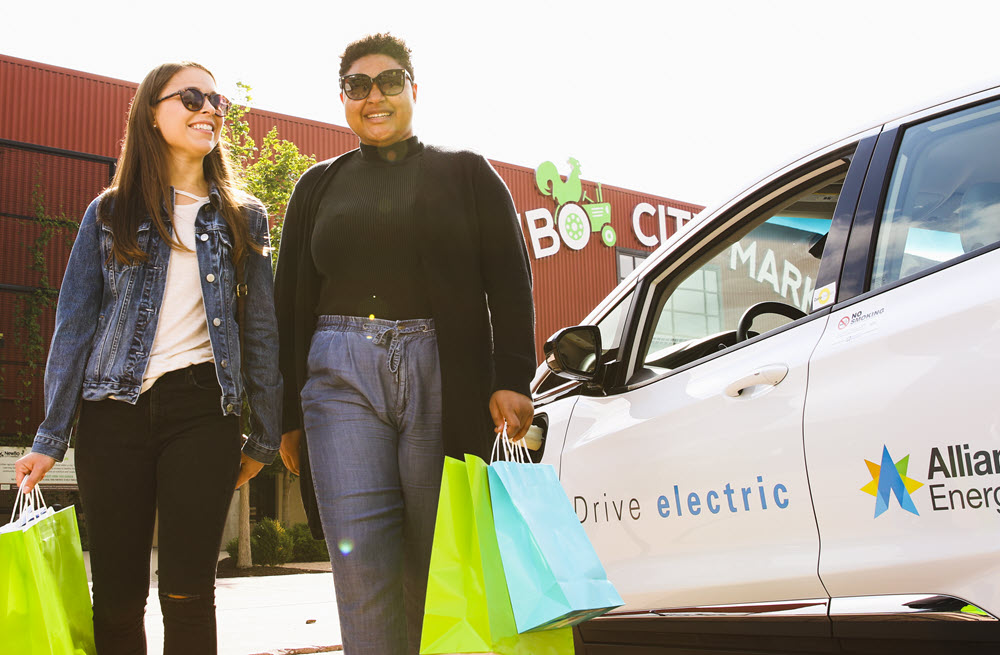 People near an electric vehicle