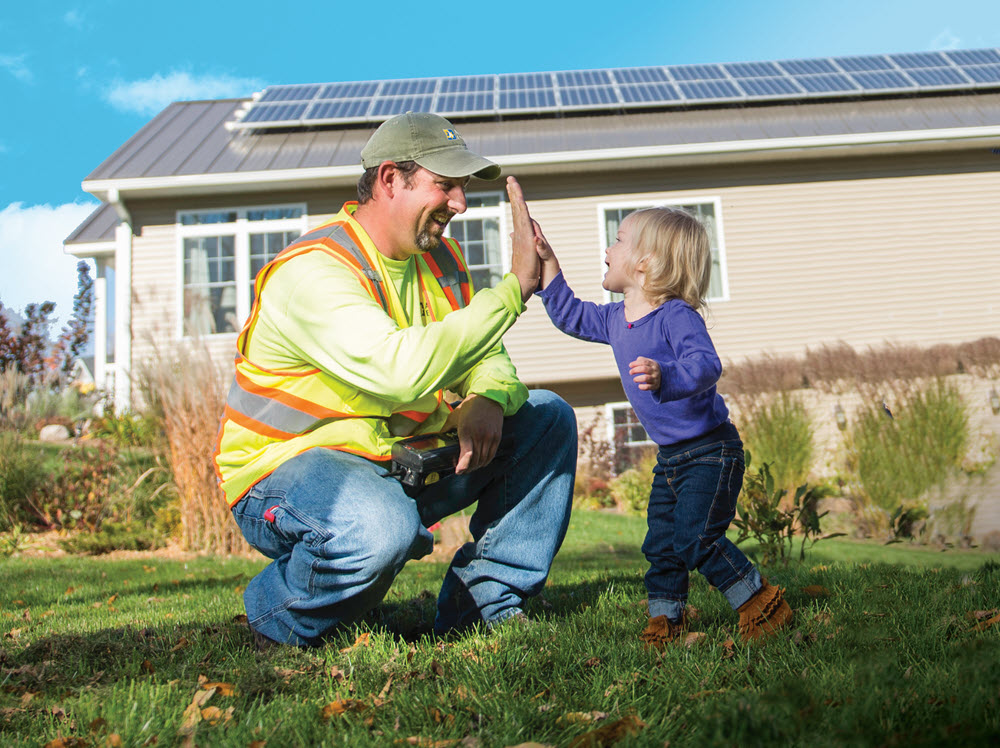 employee and child high fiving