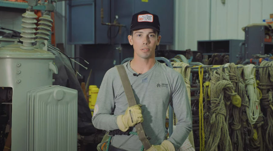 a man standing in a room with electrical equipment