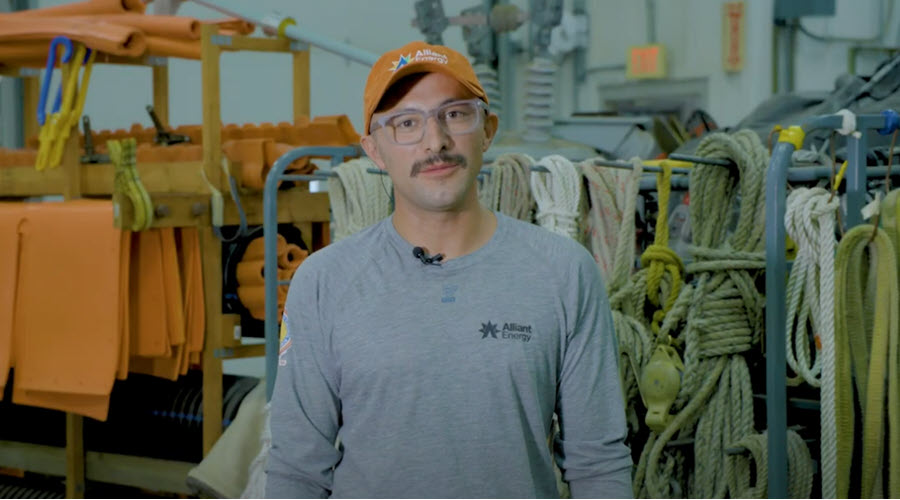 a man standing in a warehouse with lots of equipment
