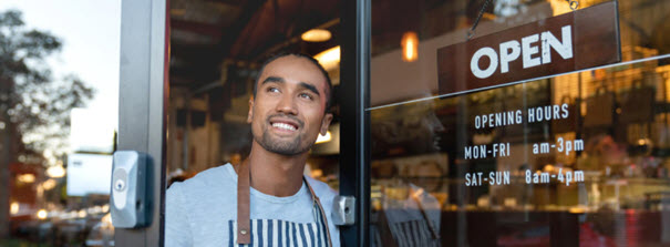 small business owner in doorway