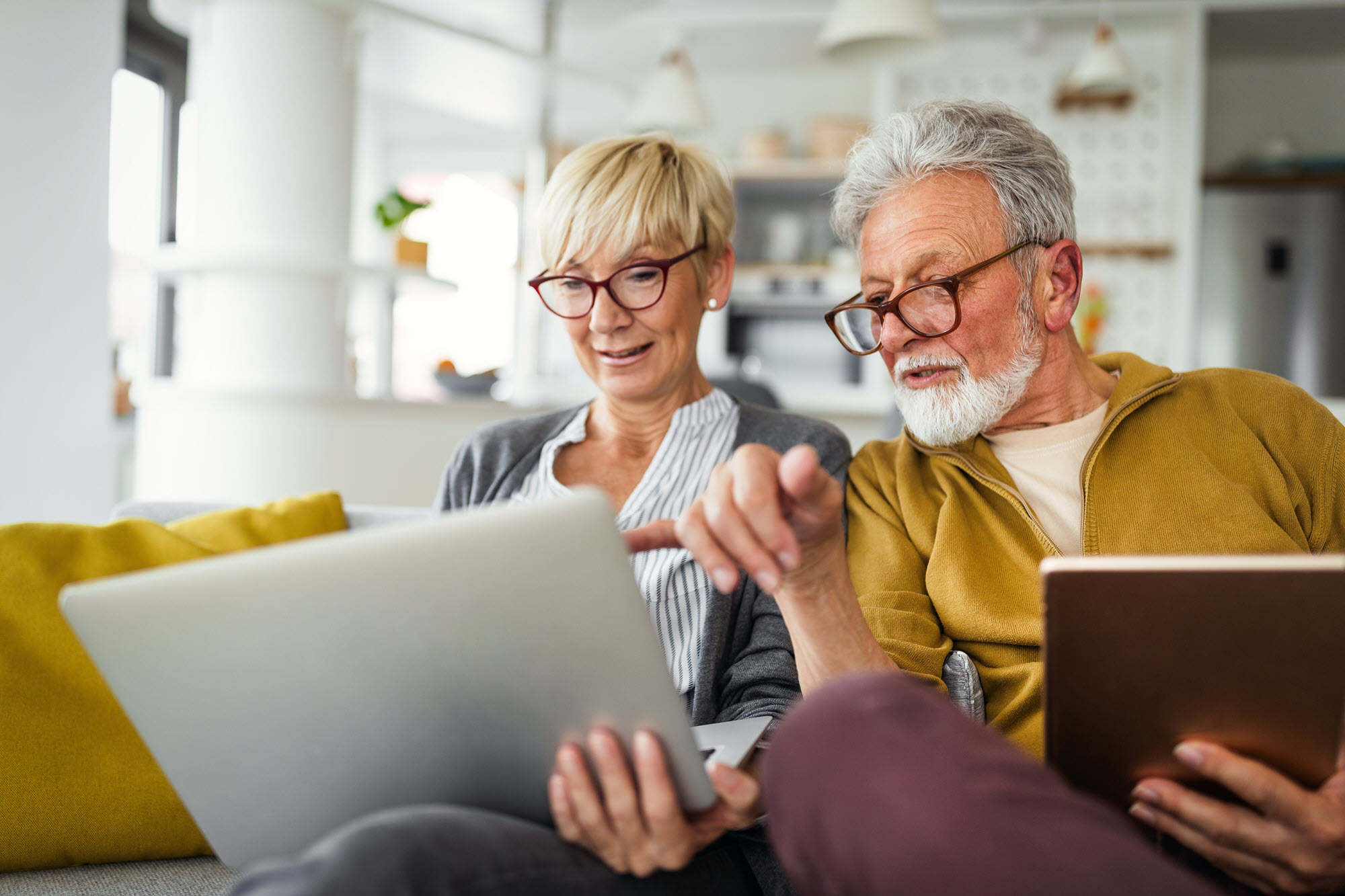 Senior couple looking at laptop