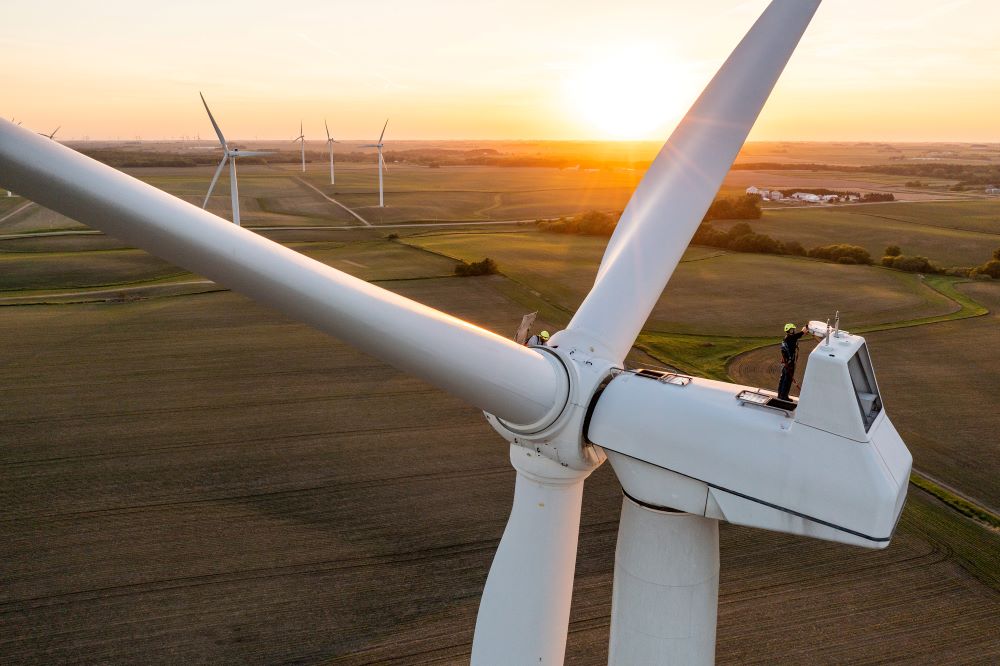 Workers atop wind turbine