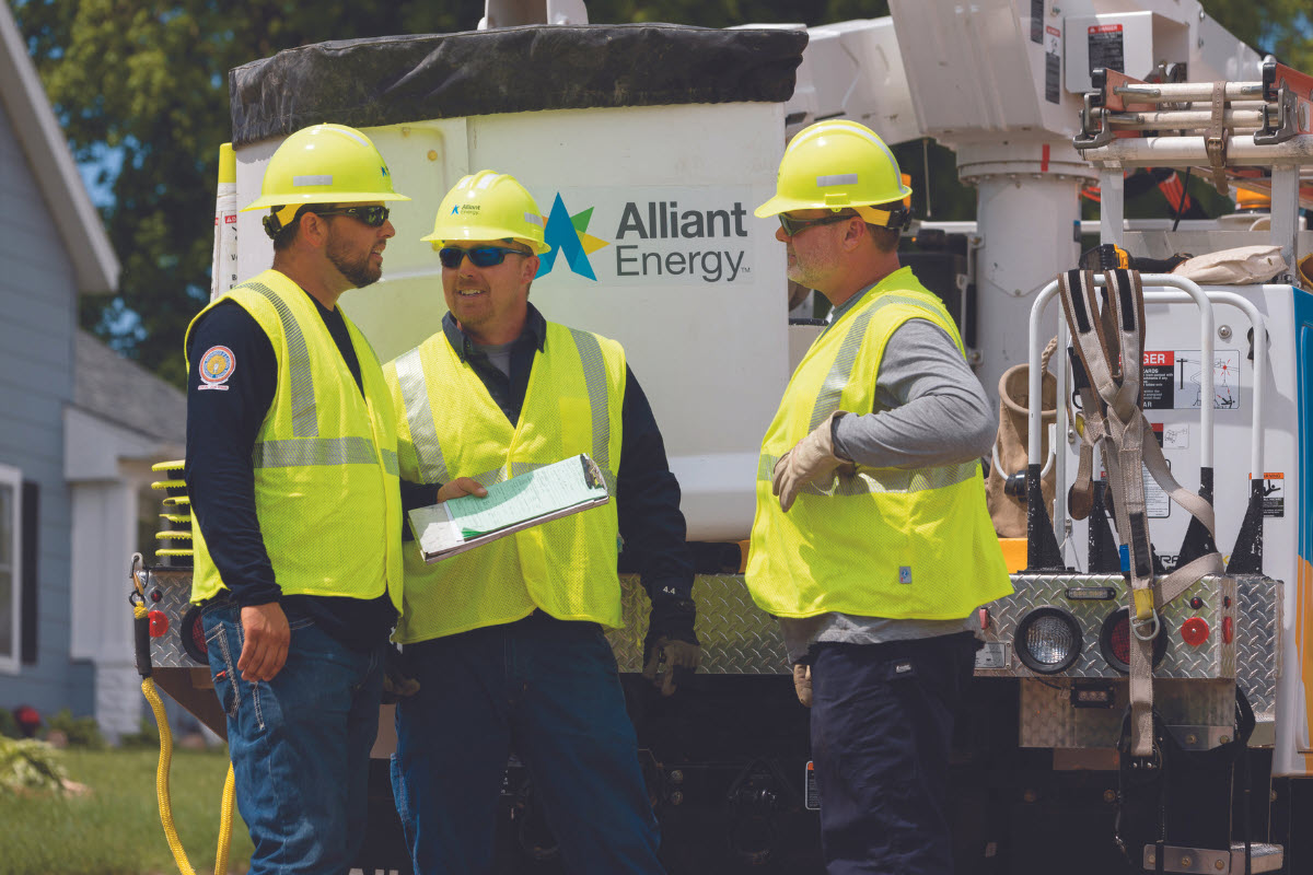Alliant Energy employees having a discussion on site