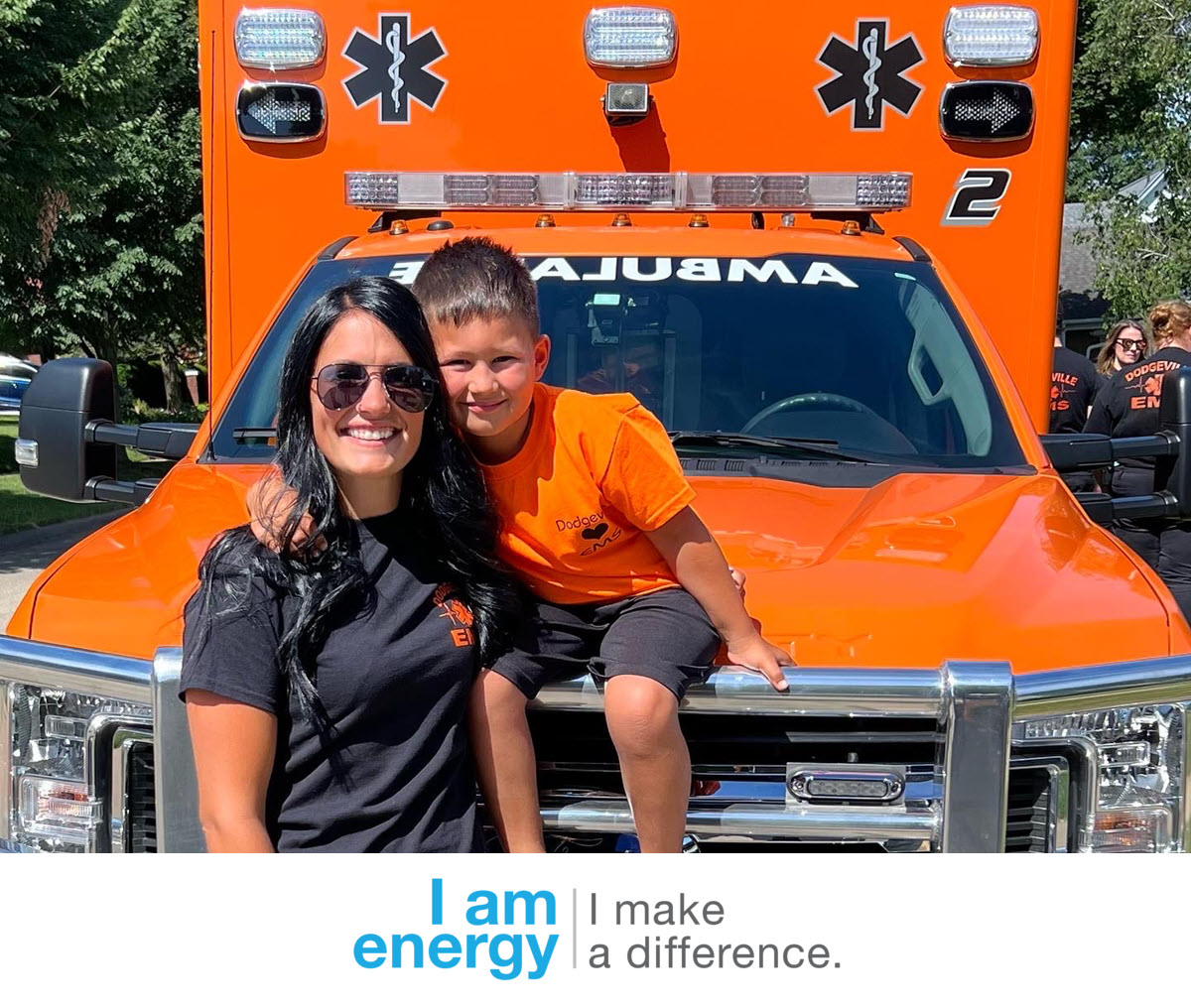 Ashley Biddick and her son near an ambulance.