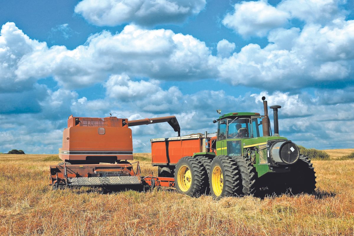 Tractor pulling combine.