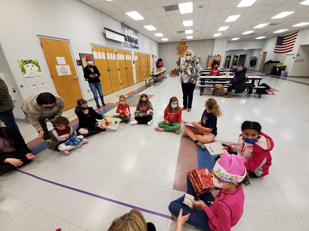 Kids sitting in a circle doing an activity