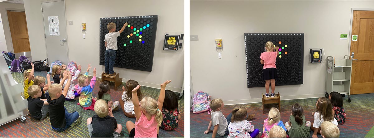 Kids playing with a large, interactive Lite Brite on a wall