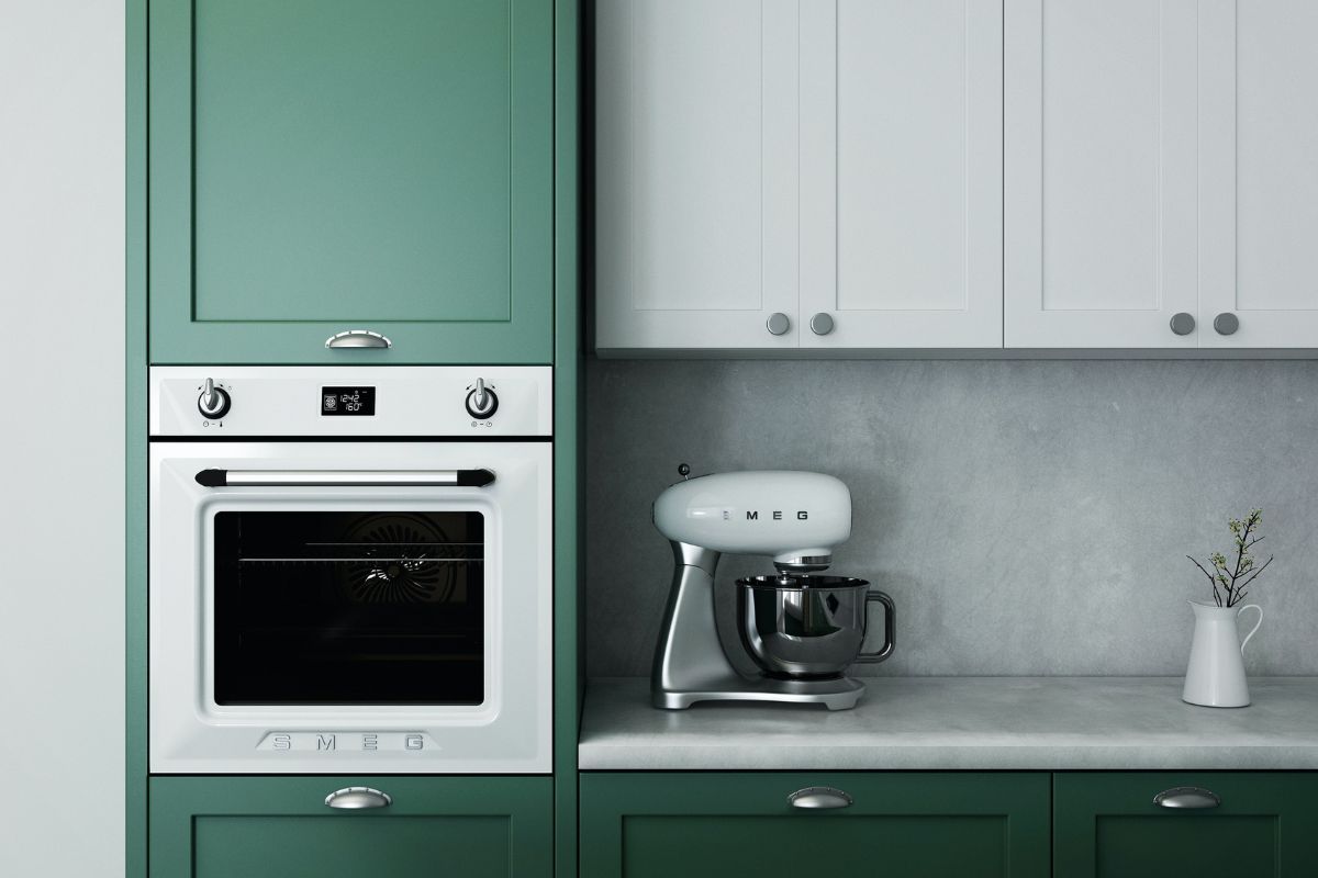 kitchen appliances in an aesthetic forest green kitchen