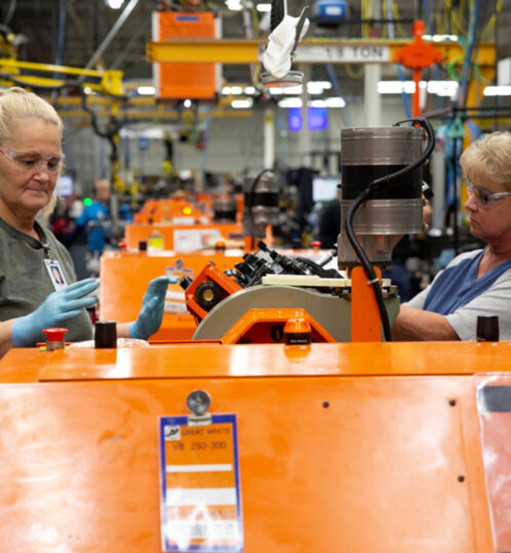 two people working in a factory