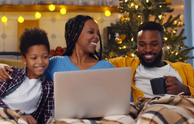 family sitting on the couch during the holidays
