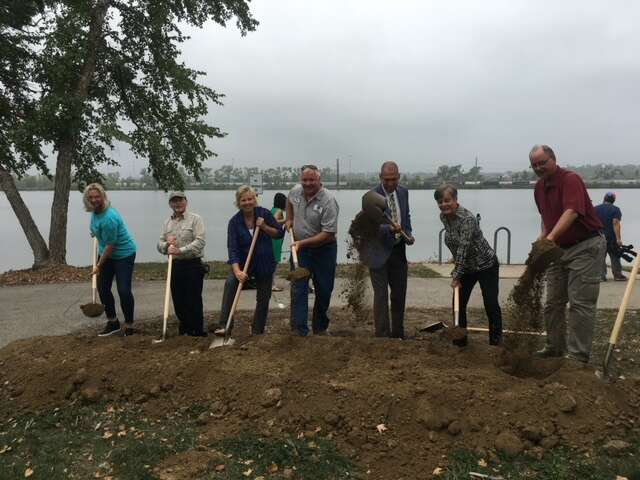 People at a groundbreaking ceremony with shovels