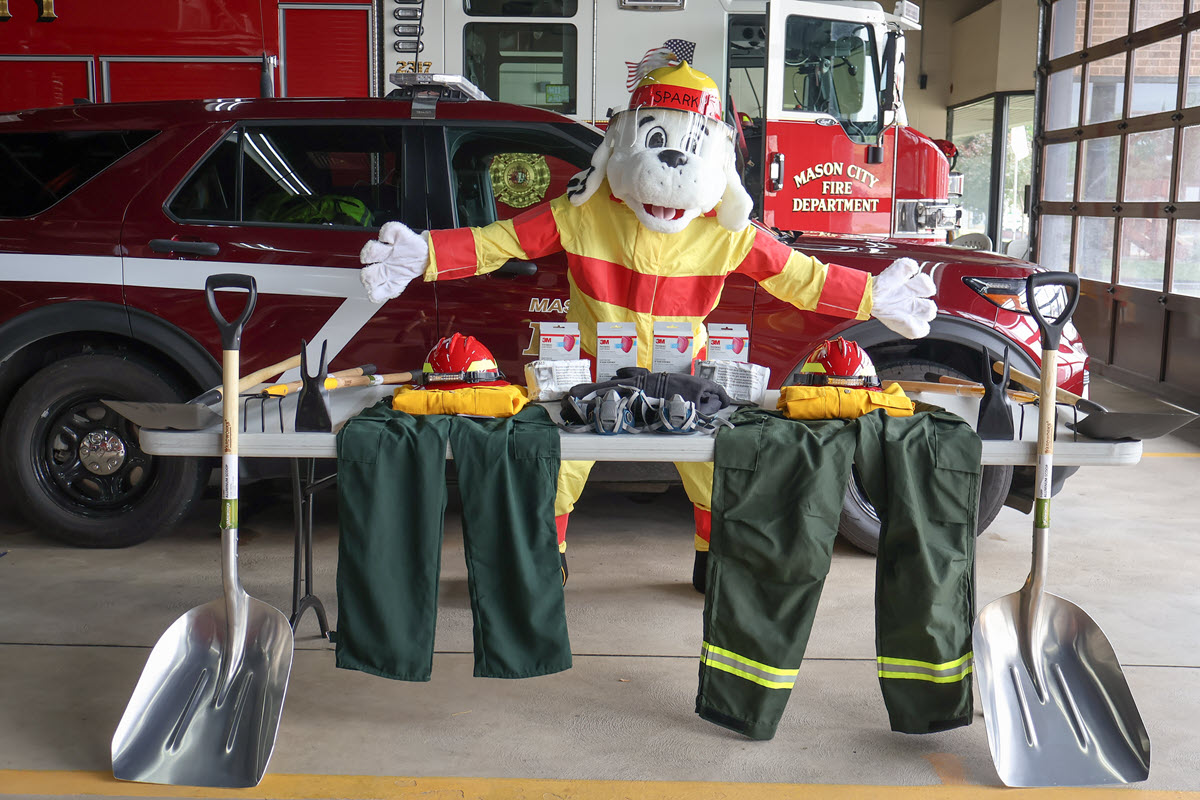 table with fire fighter gear on it