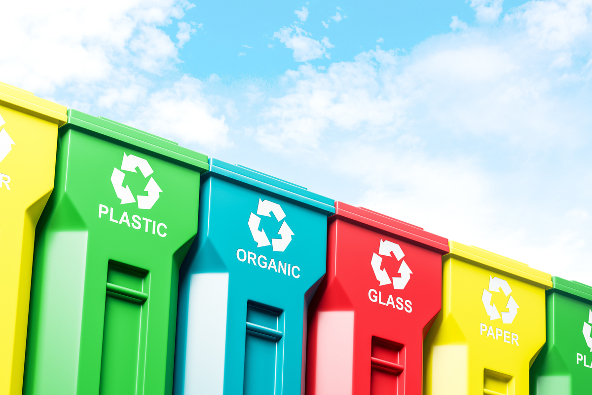 4 recycling receptacles side-by-side: plastic, organic, glass and paper.  