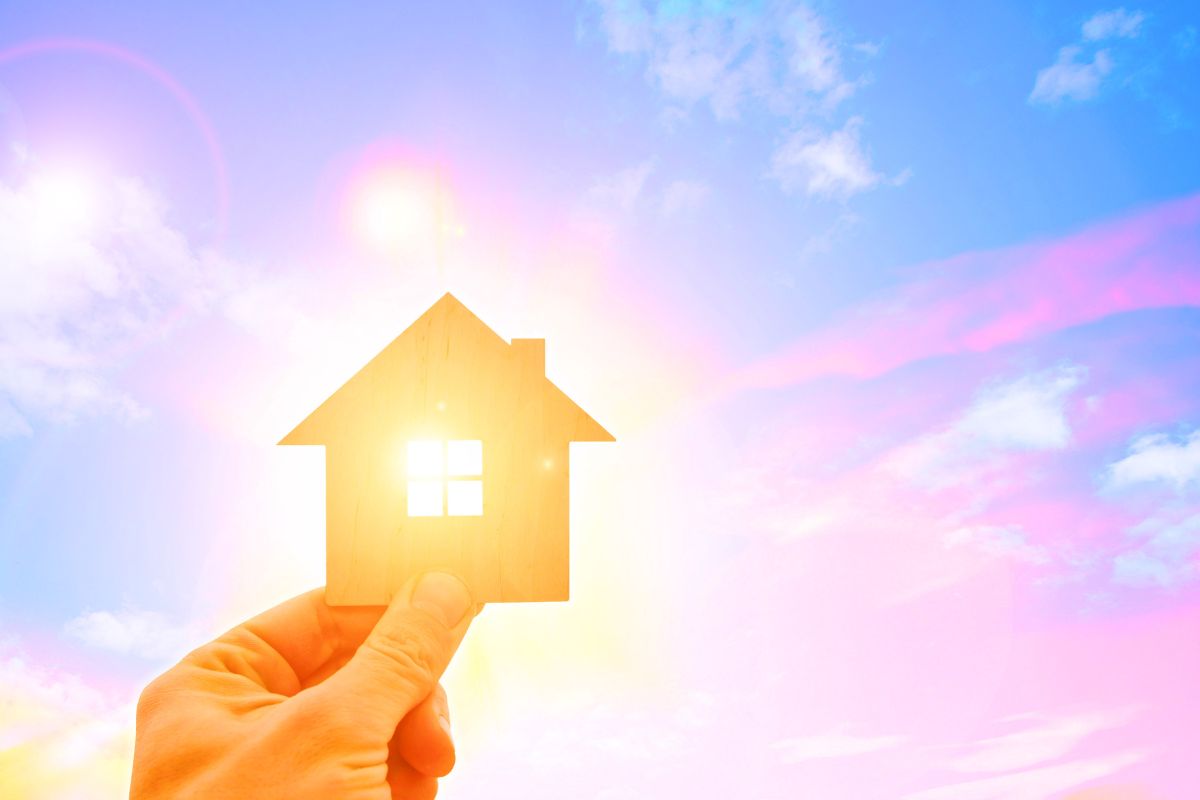 mini home cutout with sun shining through
