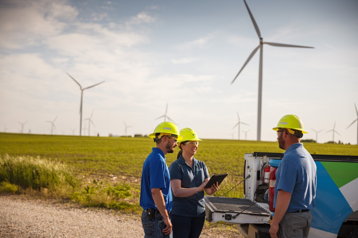 Engineers in visit a wind farm