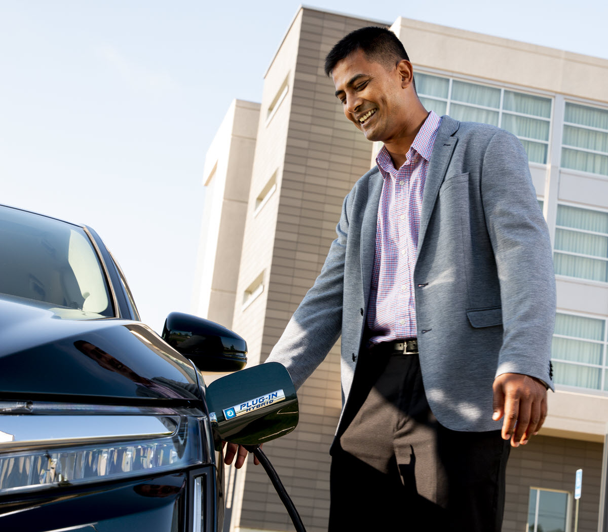 businessman charging EV