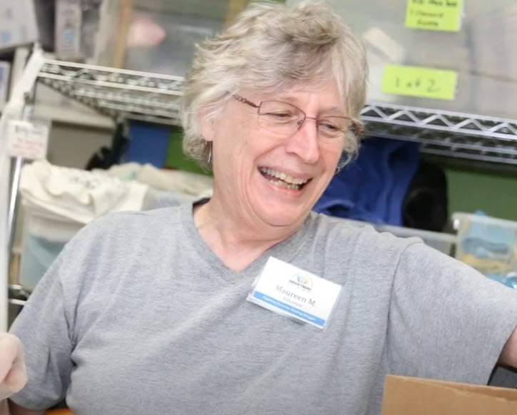 woman volunteering at a food pantry