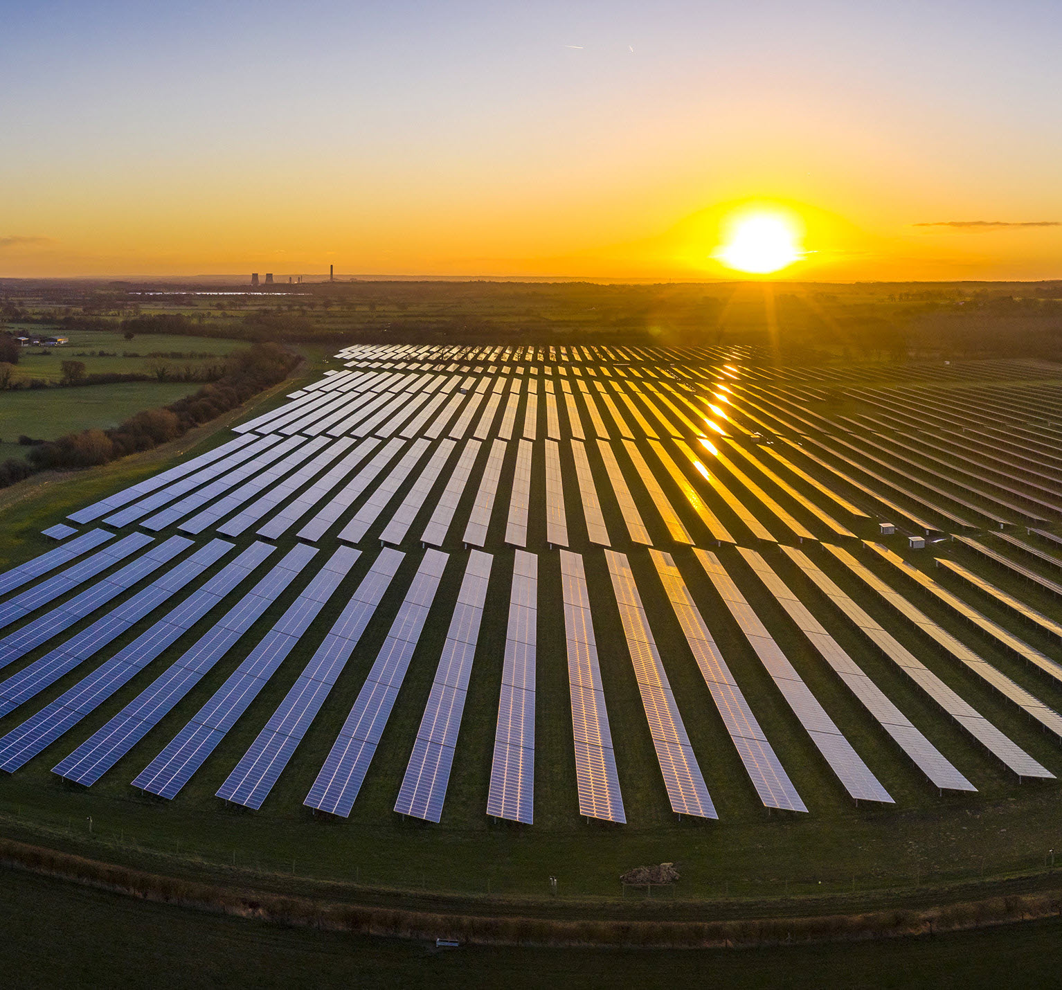 sunrise over a solar farm