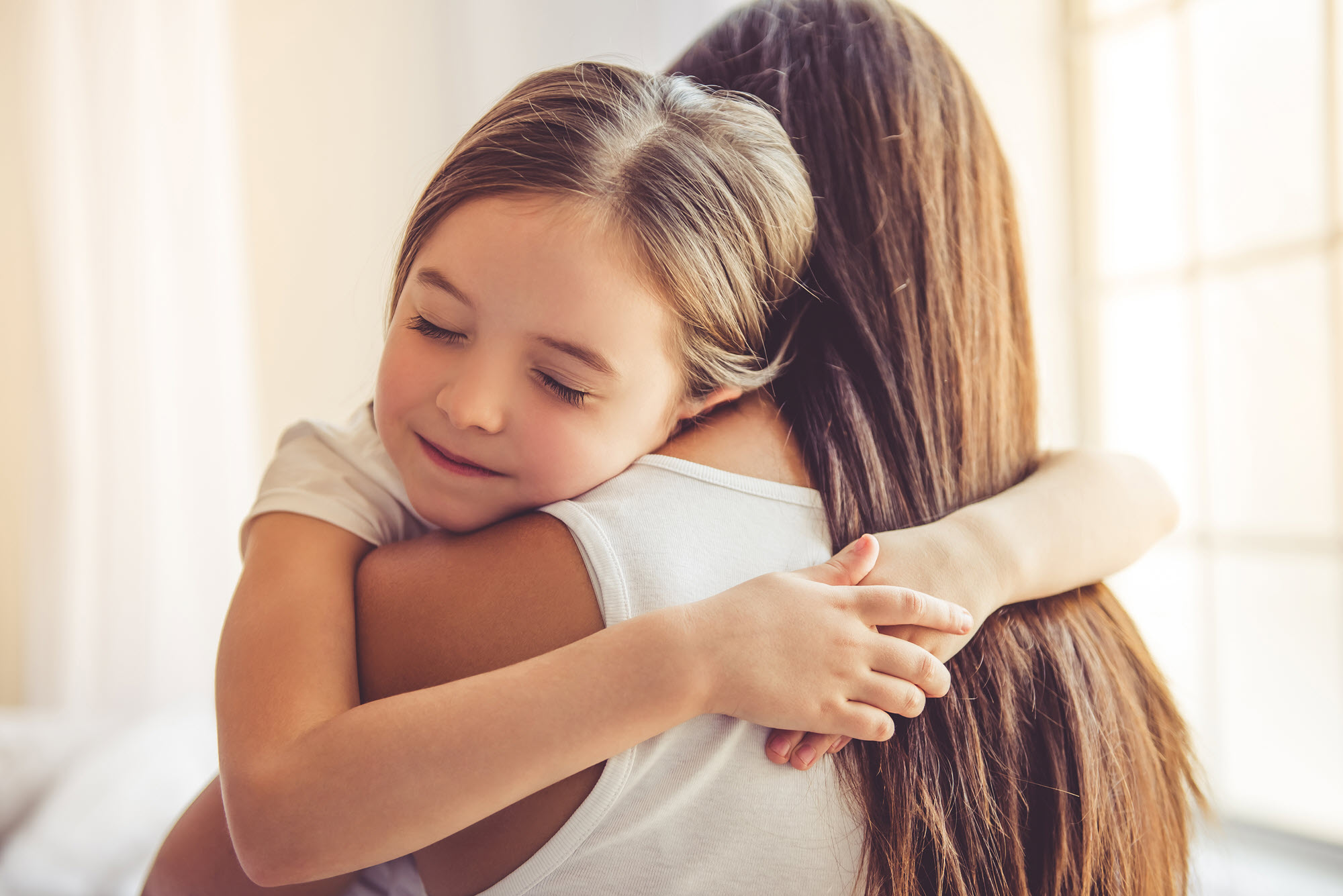 Mother hugging child