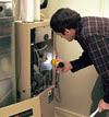 man inspecting furnace