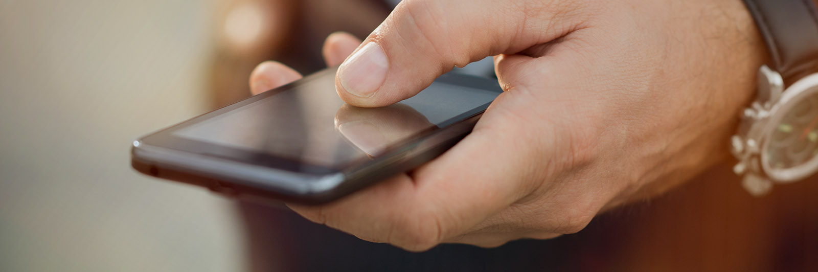 Page header image - person holding a smartphone