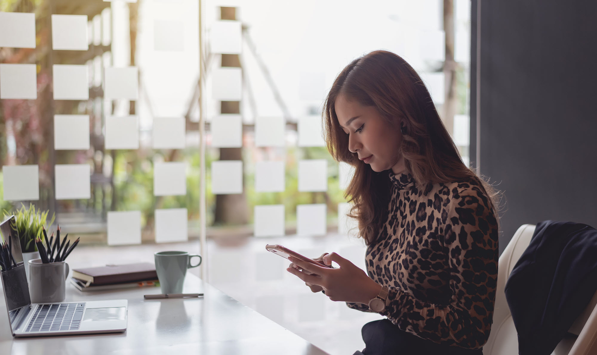woman looking at cell phone