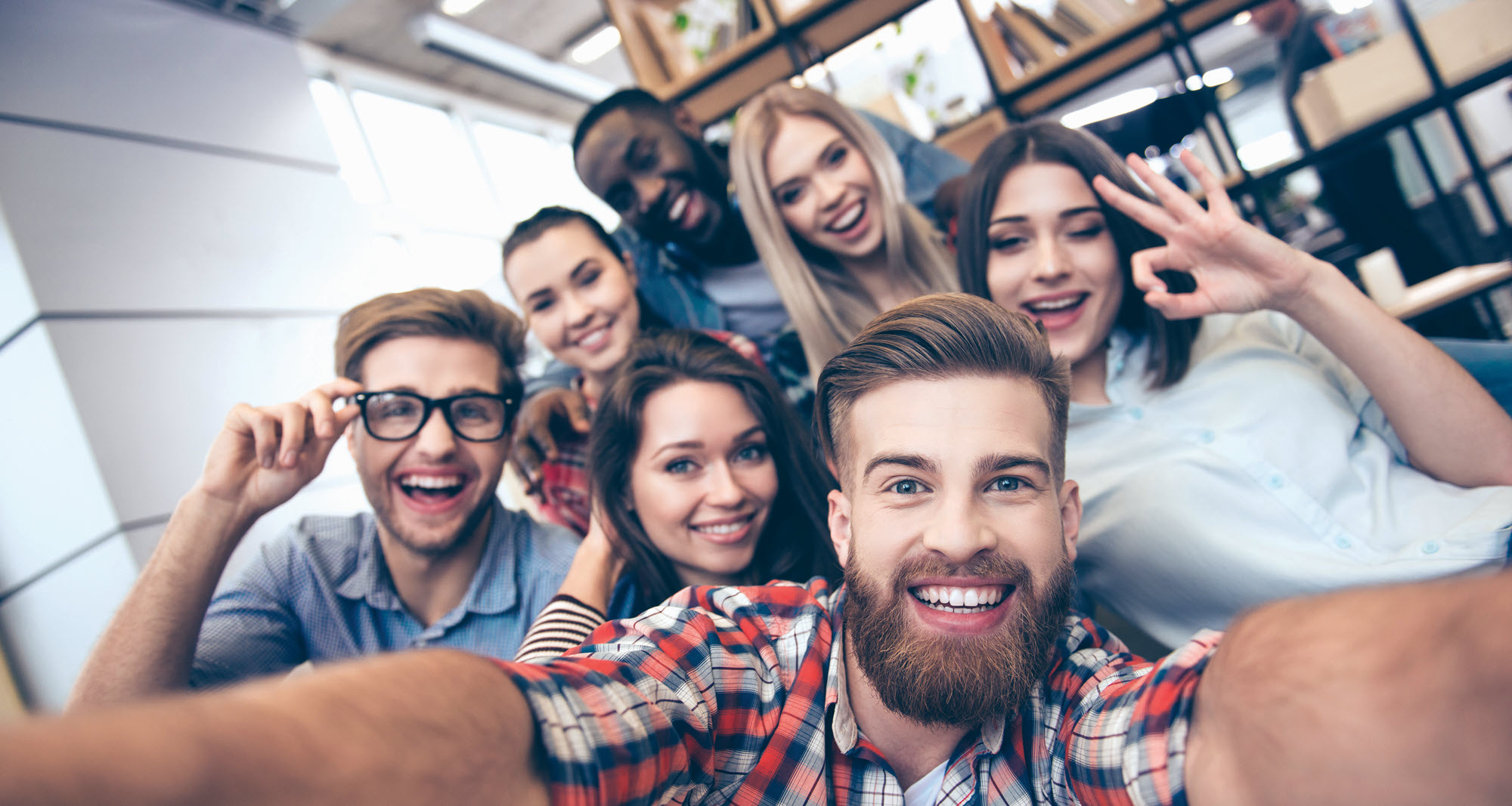 group of young people taking a selfie