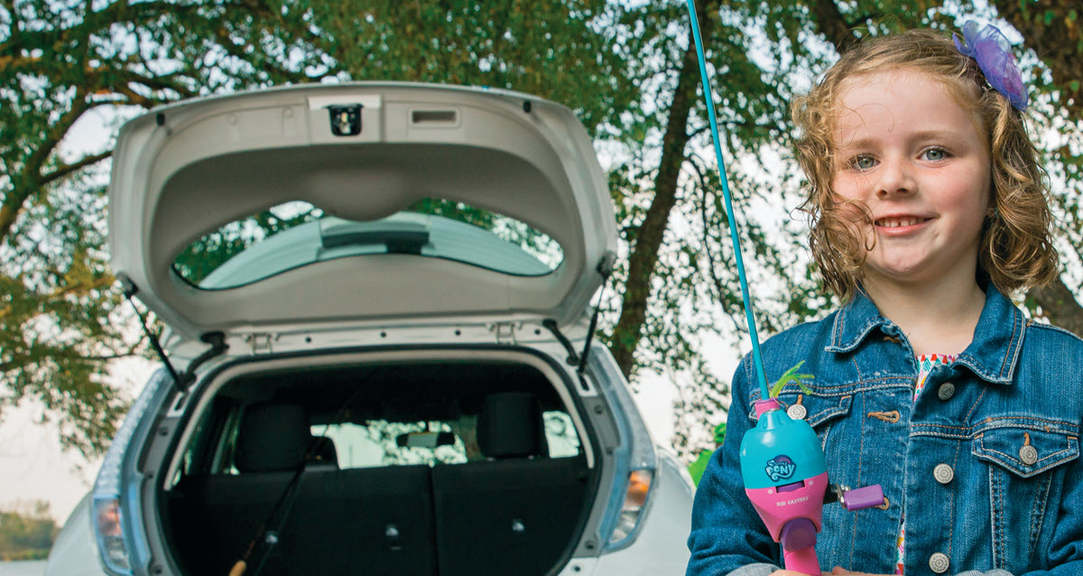 girl next to an EV