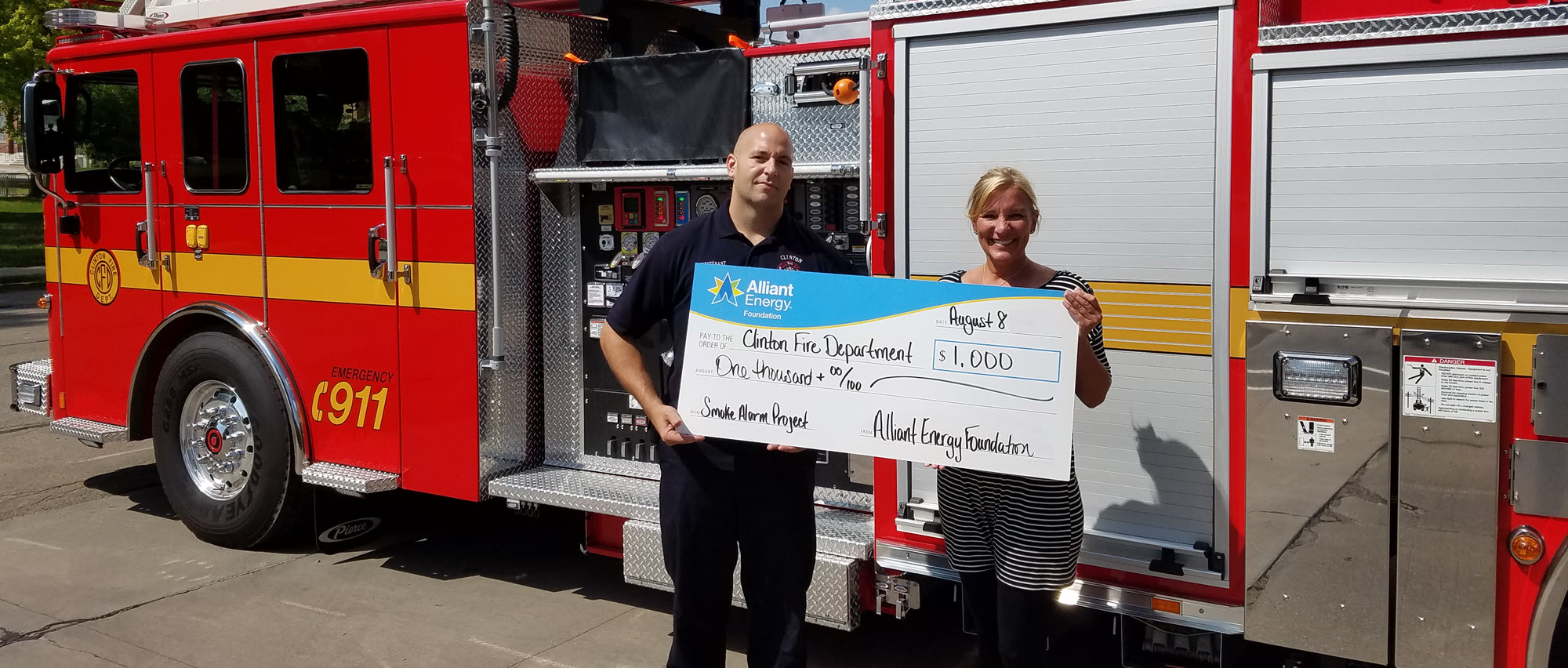 fire department receiving check from the Alliant Energy Foundation