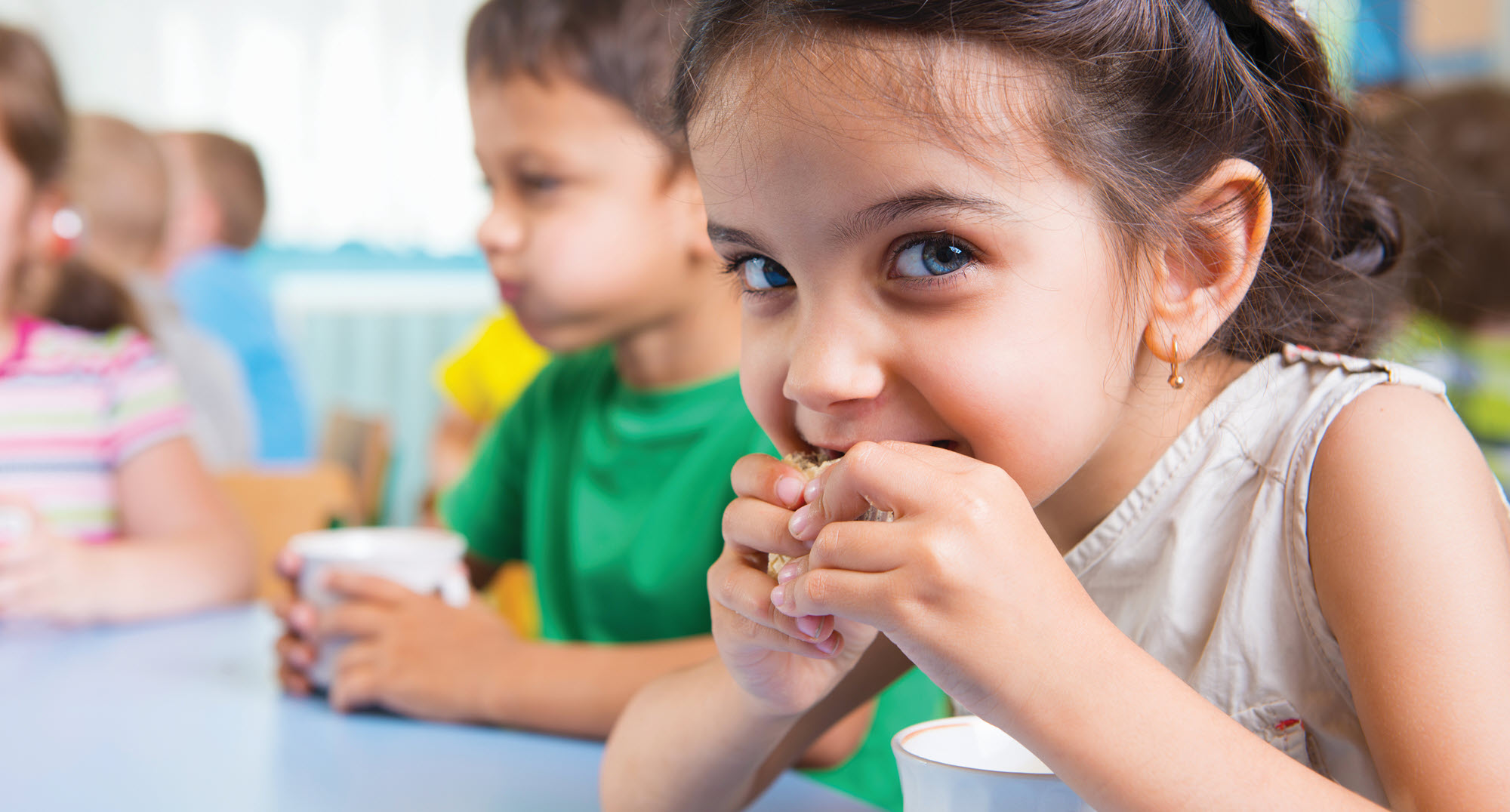 little girl eating lunch