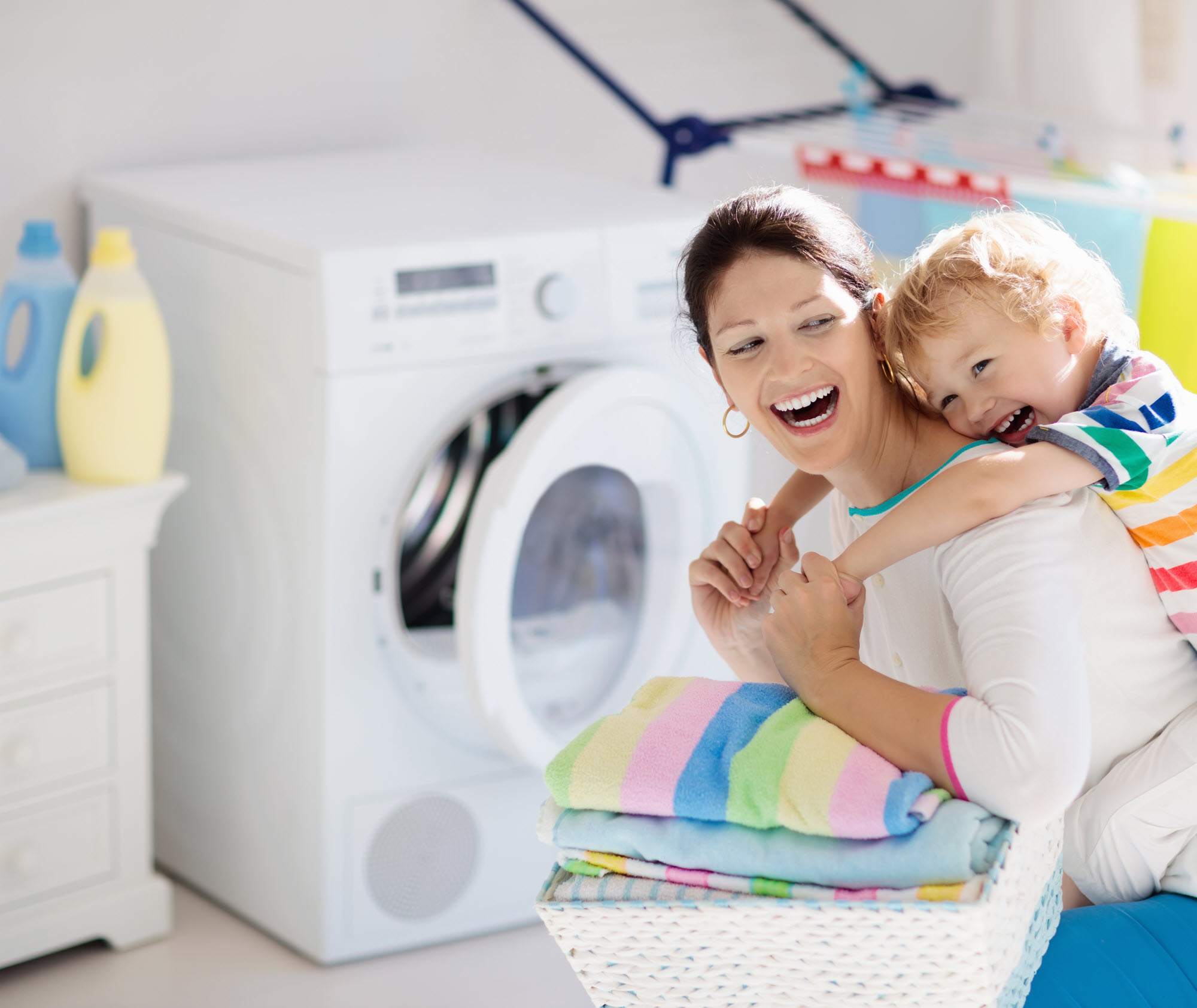 Mom and child doing laundry