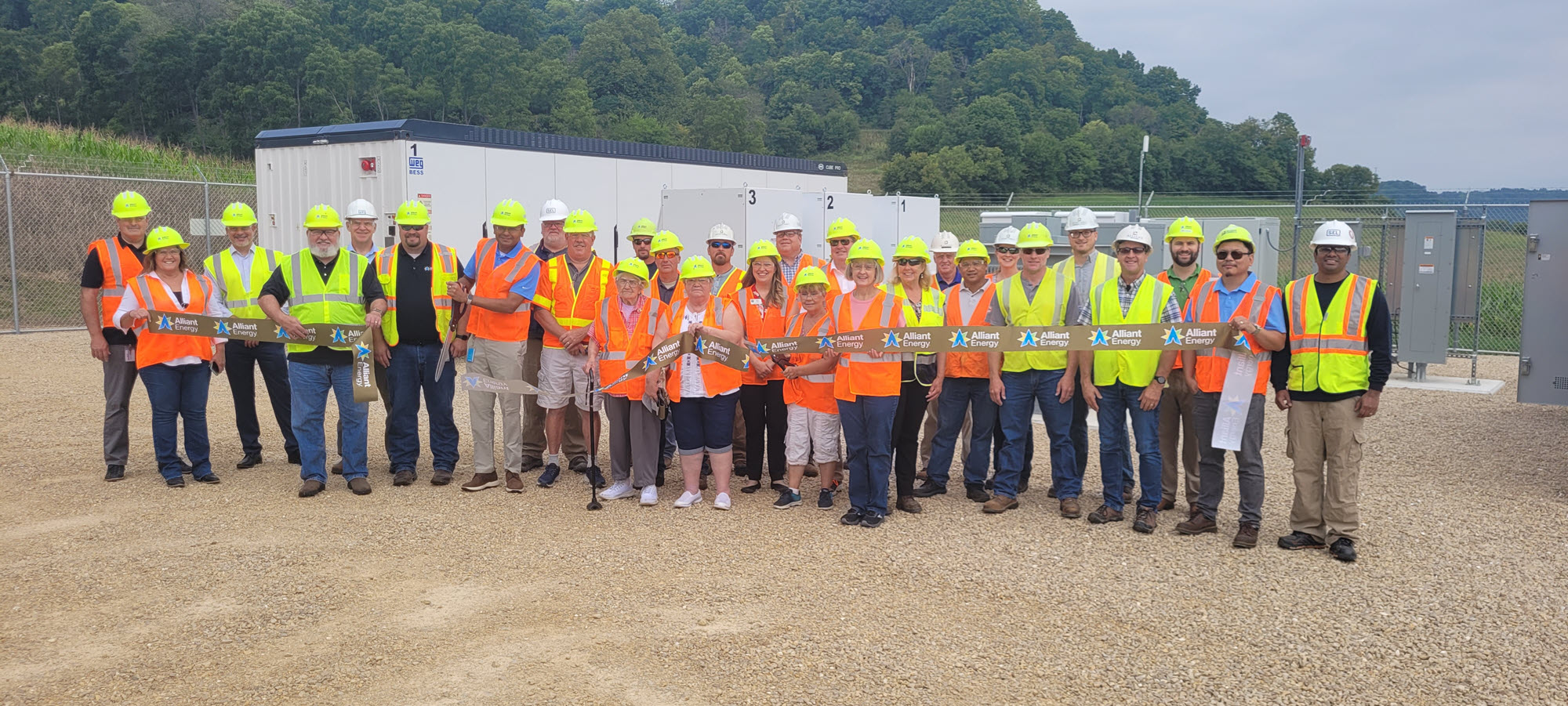 group of people at a ribbon cutting