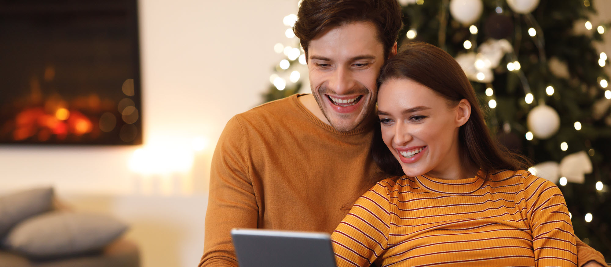 couple looking at a tablet
