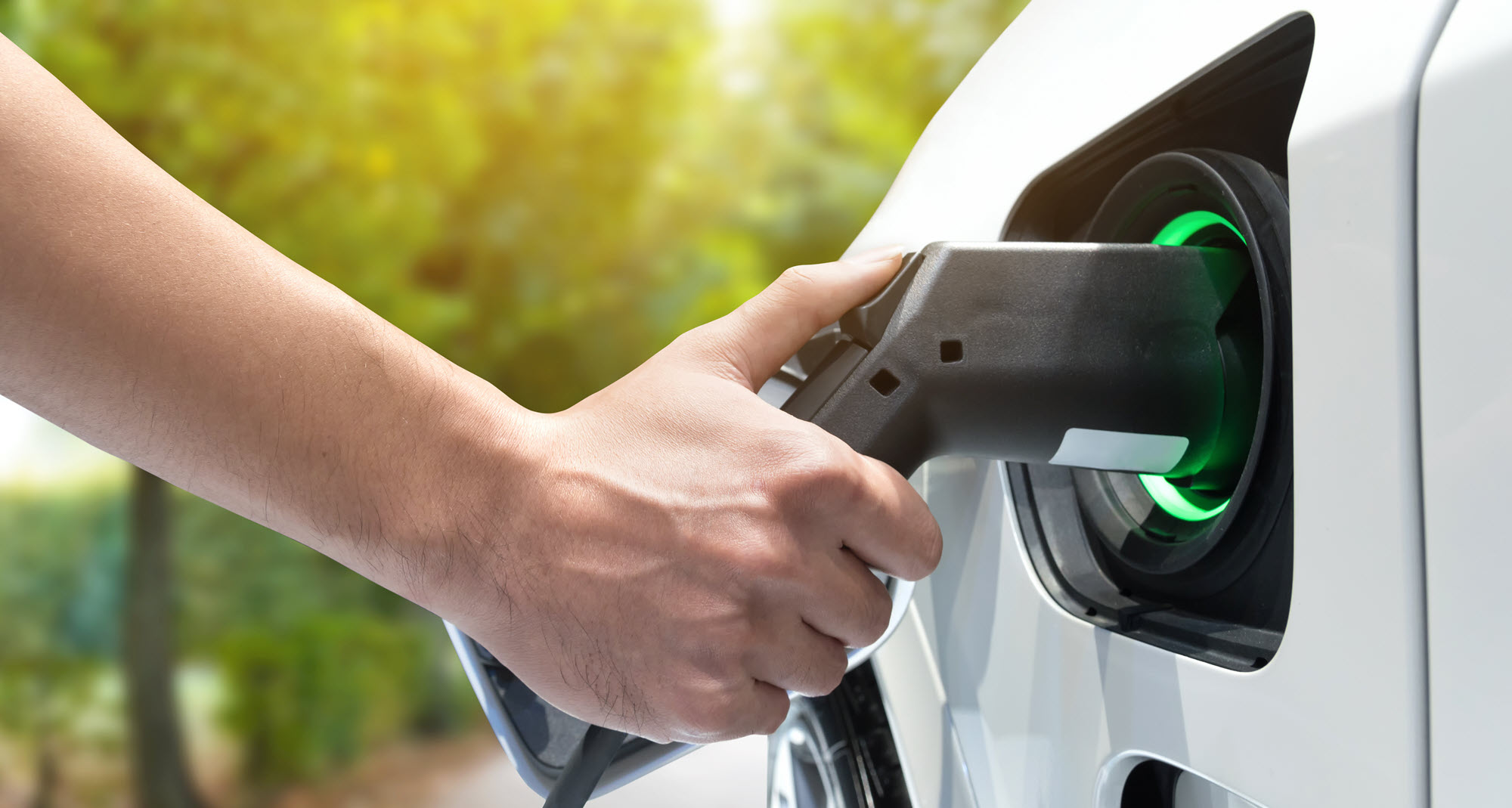 person charging an EV