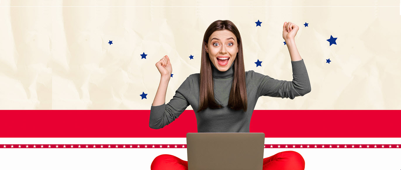 excited women on a laptop