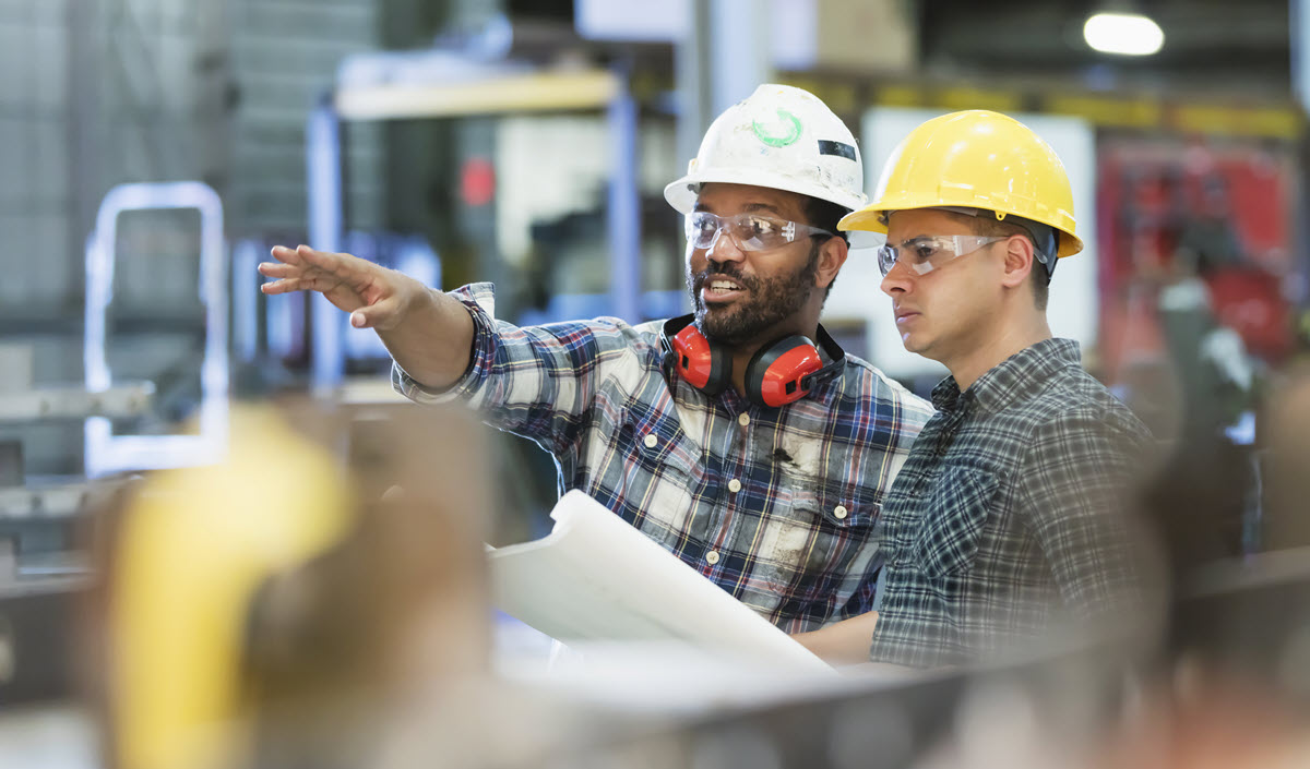 two men in an industrial setting