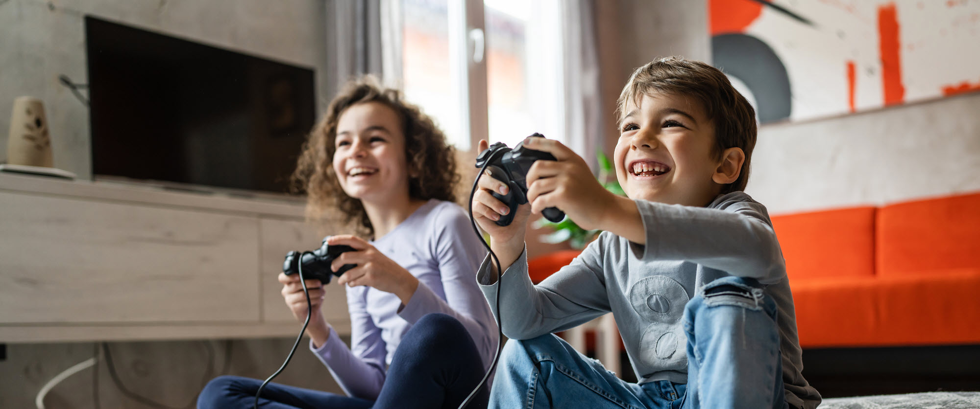 happy kids playing video games