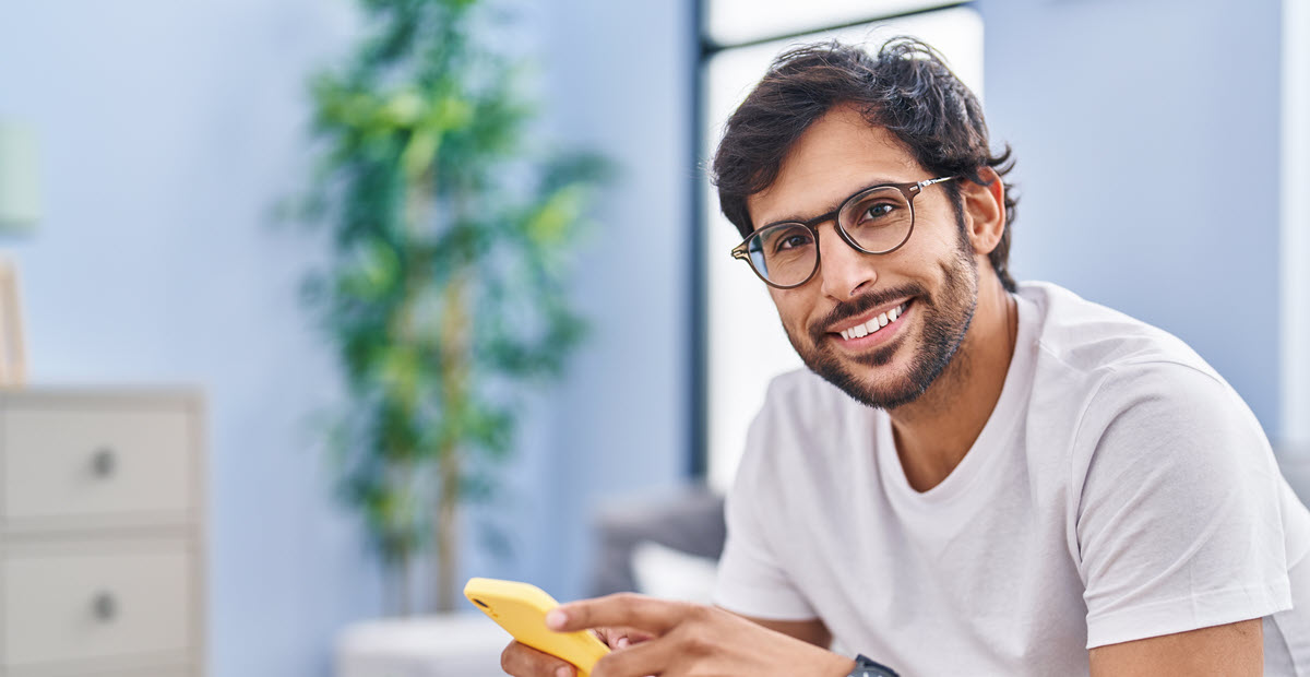 smiling man on phone